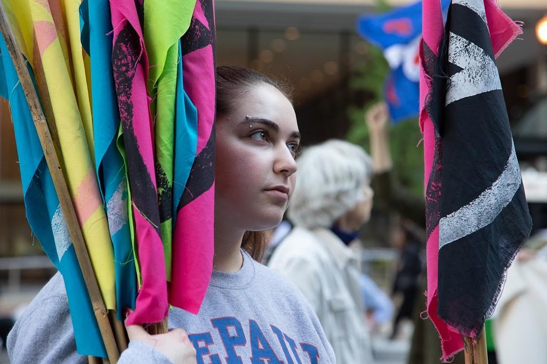 Oct 7th - Launch of the International Rebellion - Handing out XR flags to Critical Mass cyclists (Photo Credit: Denise Poloyac)