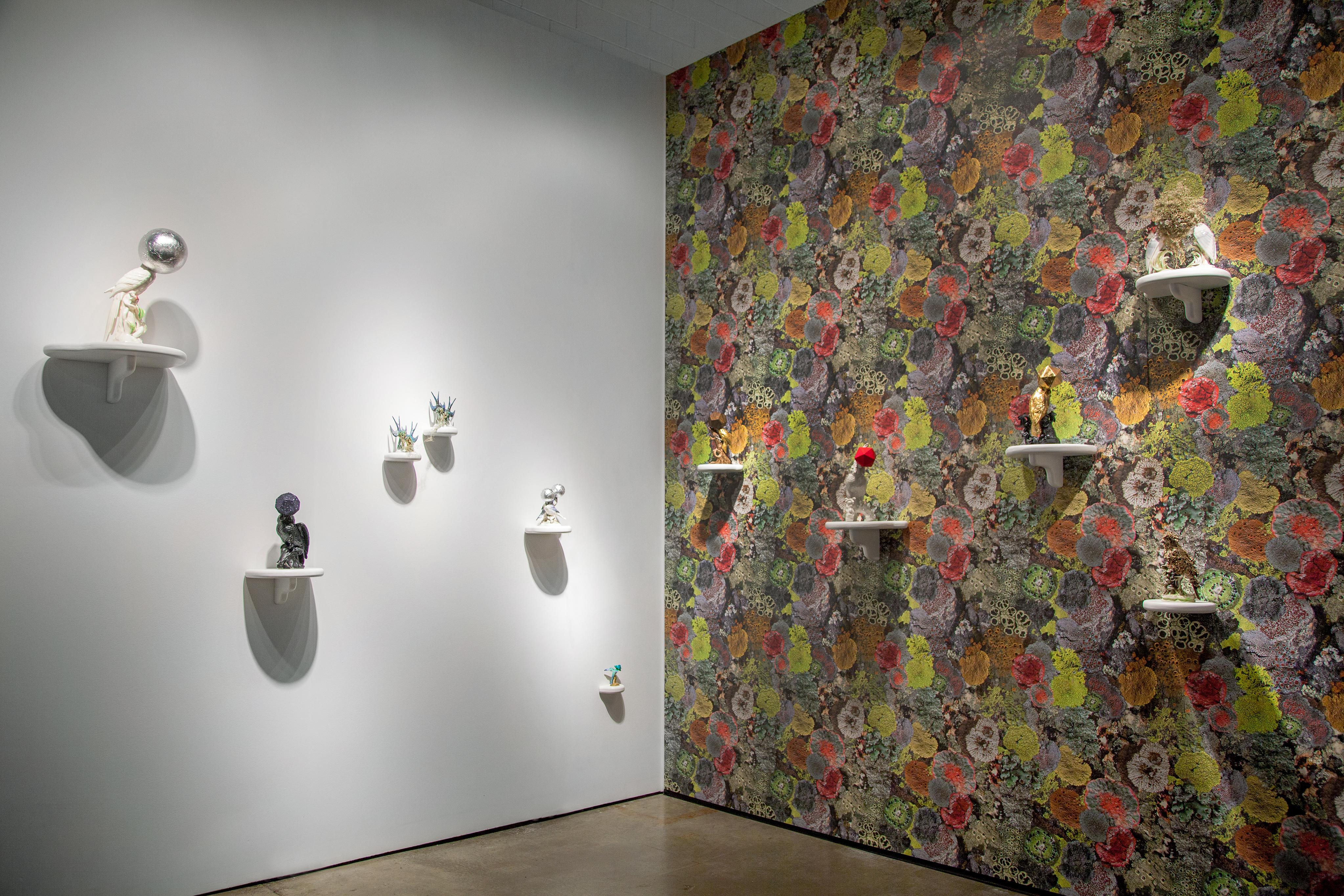 View of Camouflage bird sculptures and Natural Camouflage Lichen Wallpaper, which accompanied Tell it to the Birds at EXPO Chicago