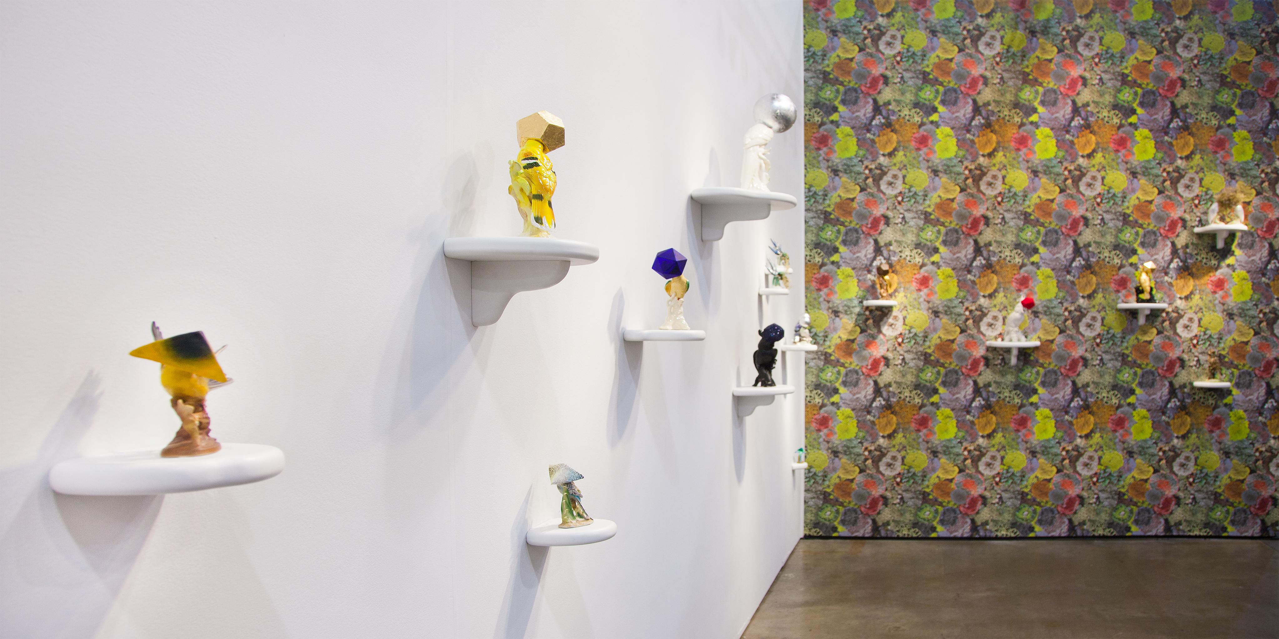 View of Camouflage bird sculptures and Natural Camouflage Lichen Wallpaper, which accompanied Tell it to the Birds at EXPO Chicago